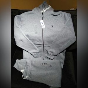 Gray polo sweat suit in a XL in boys for $120